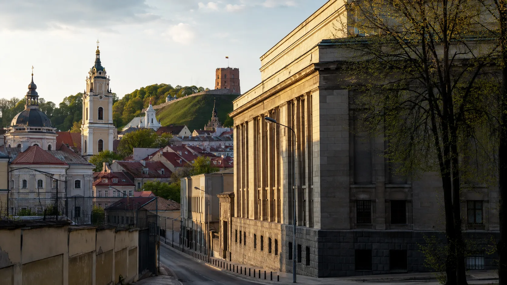 Vilnius Old Town and Gediminas Hill beside the former KGB prison building.