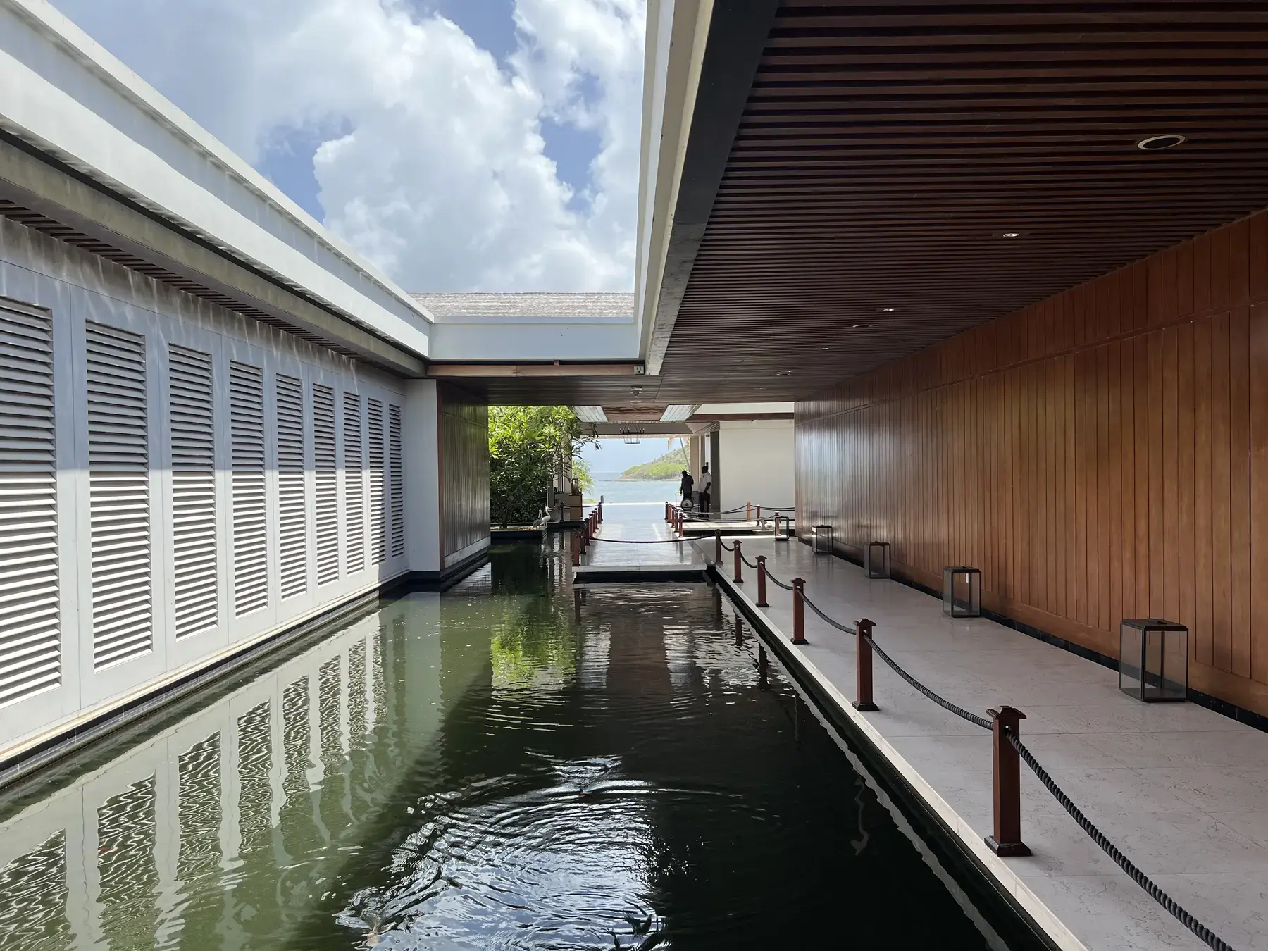 Water-lined arrival corridor at Park Hyatt St. Kitts opening toward the Caribbean Sea