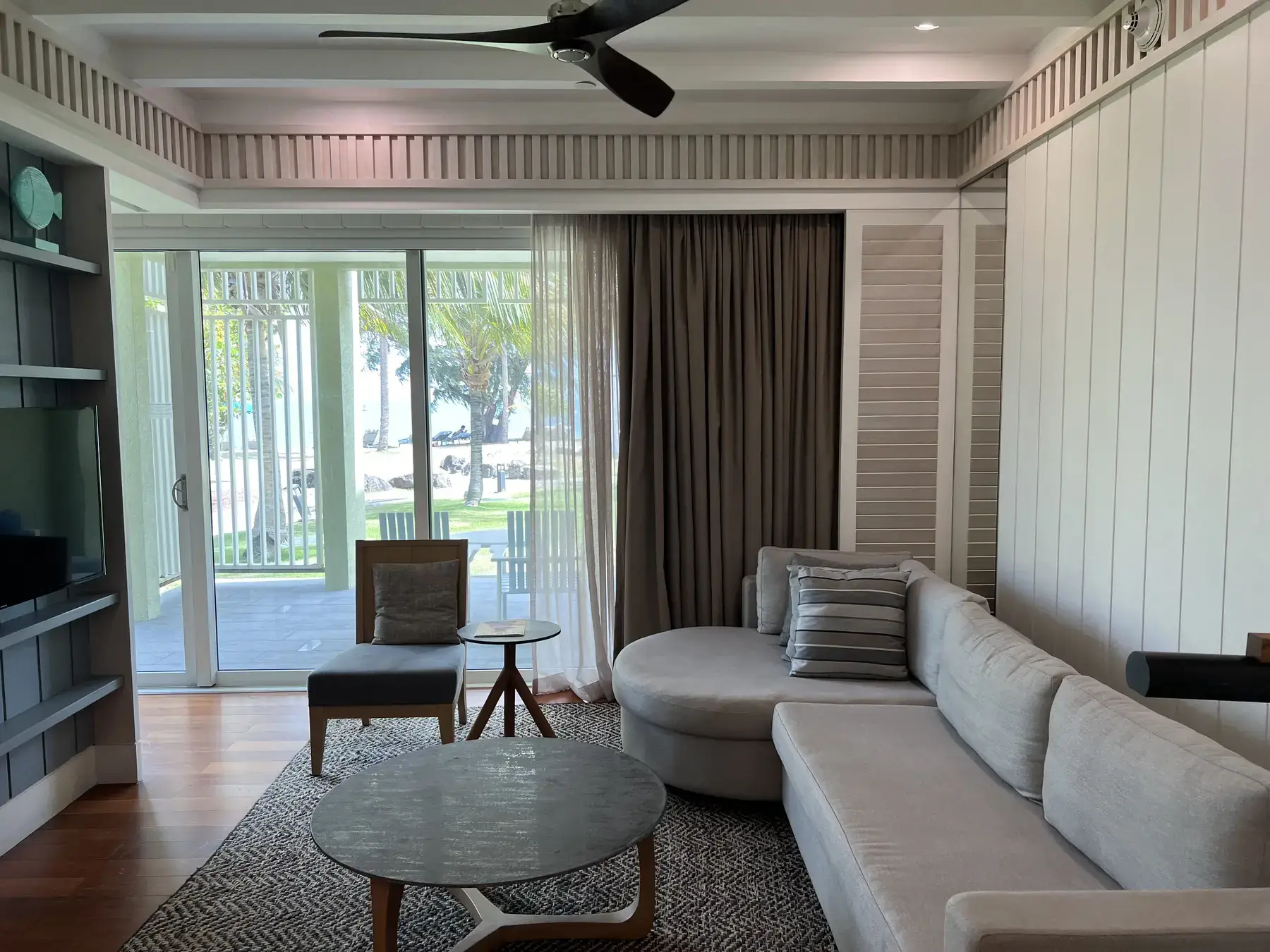 Separate living room opening onto a terrace in a Park Hyatt St. Kitts suite