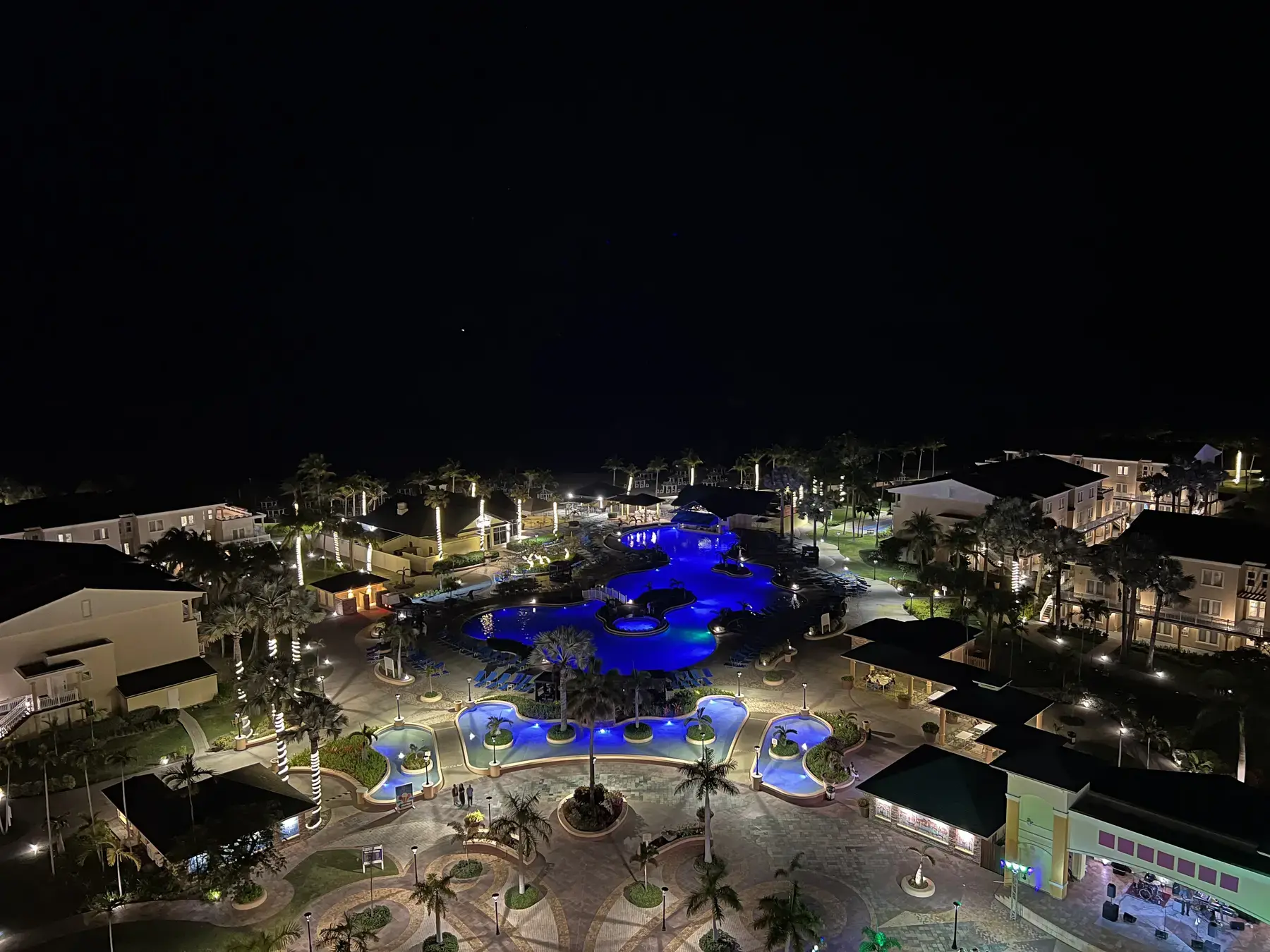 Pools and public spaces illuminated at night at St. Kitts Marriott