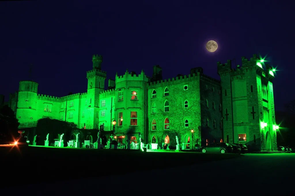 Cabra Castle exterior in Kingscourt, lit green in the evening