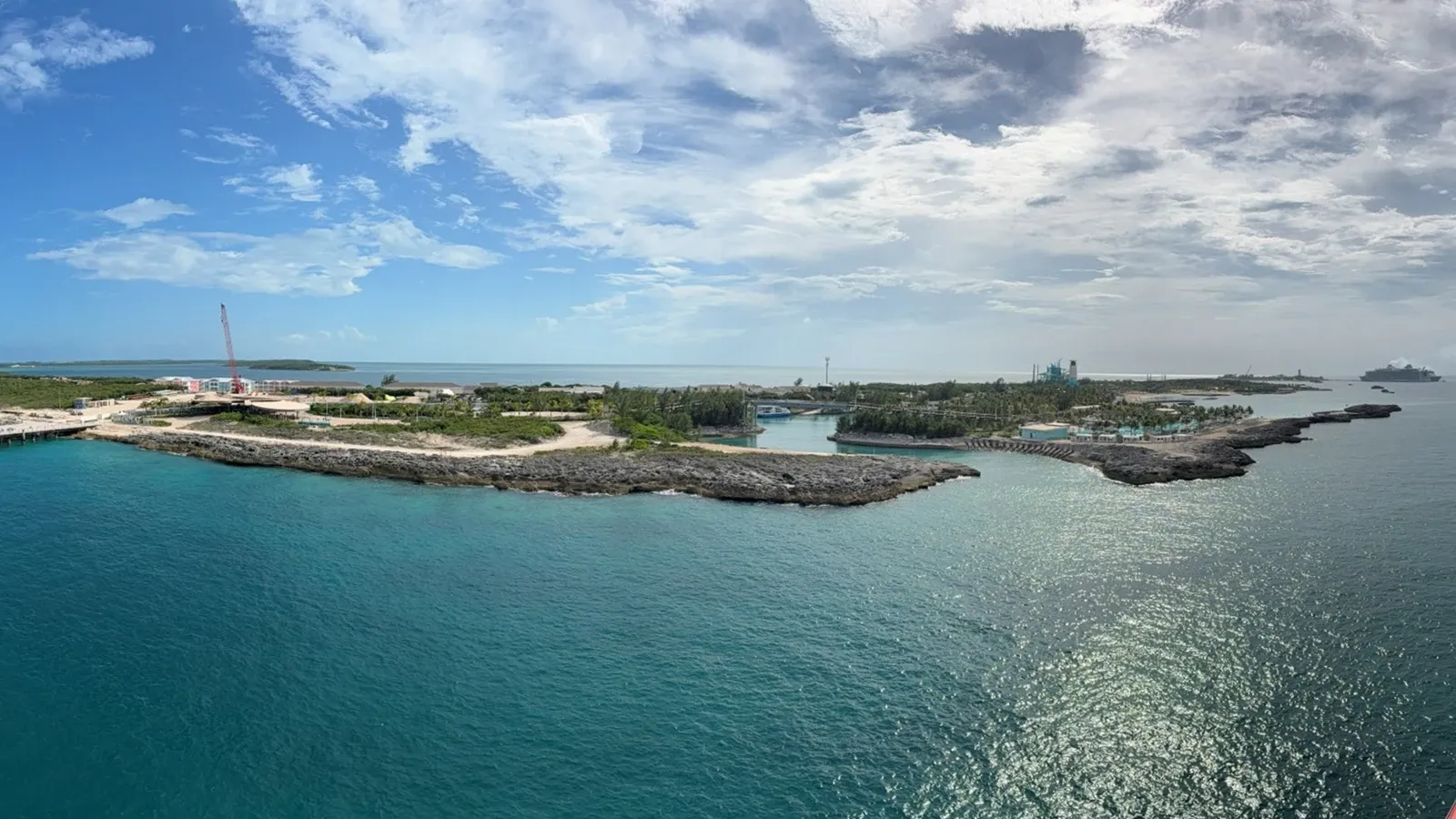 A wide view of Great Stirrup Cay’s shoreline, pier and turquoise water from Norwegian Getaway.