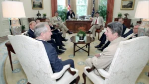 Oleg Gordievsky, seated at left, meeting President Ronald Reagan in the Oval Office in July 1987.
